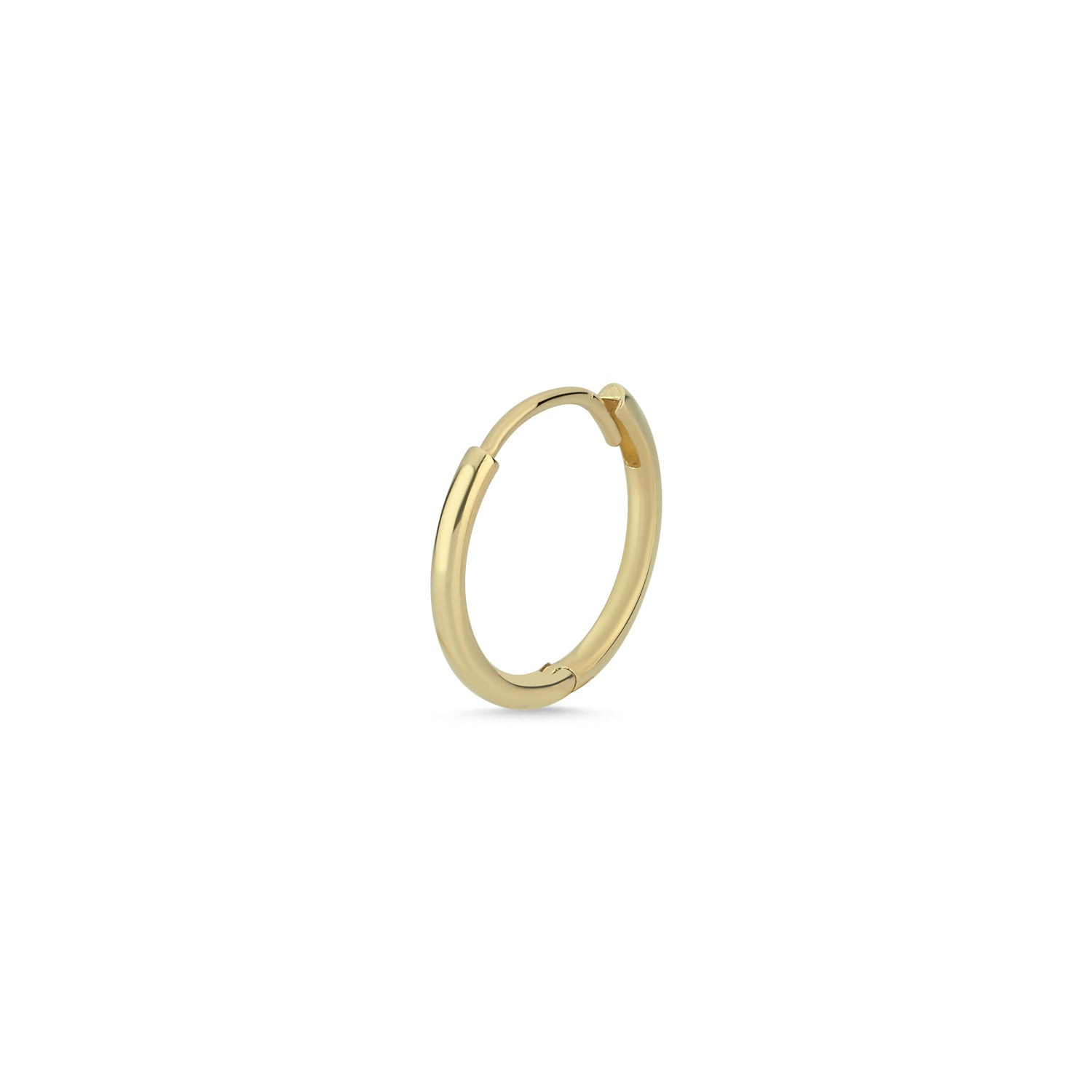 Gold hoop earring on a white background