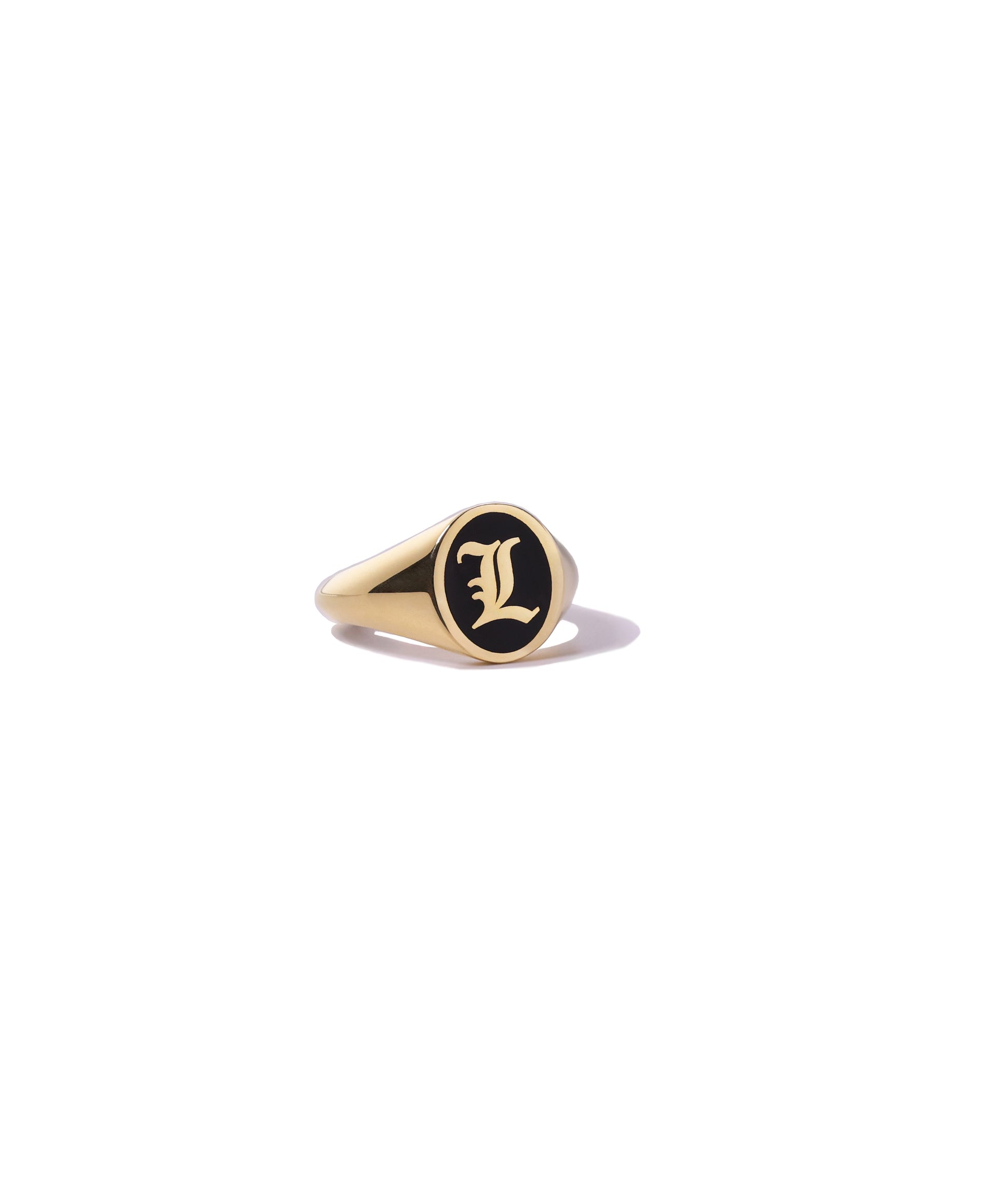 personalized gold initial ring with black enamel.