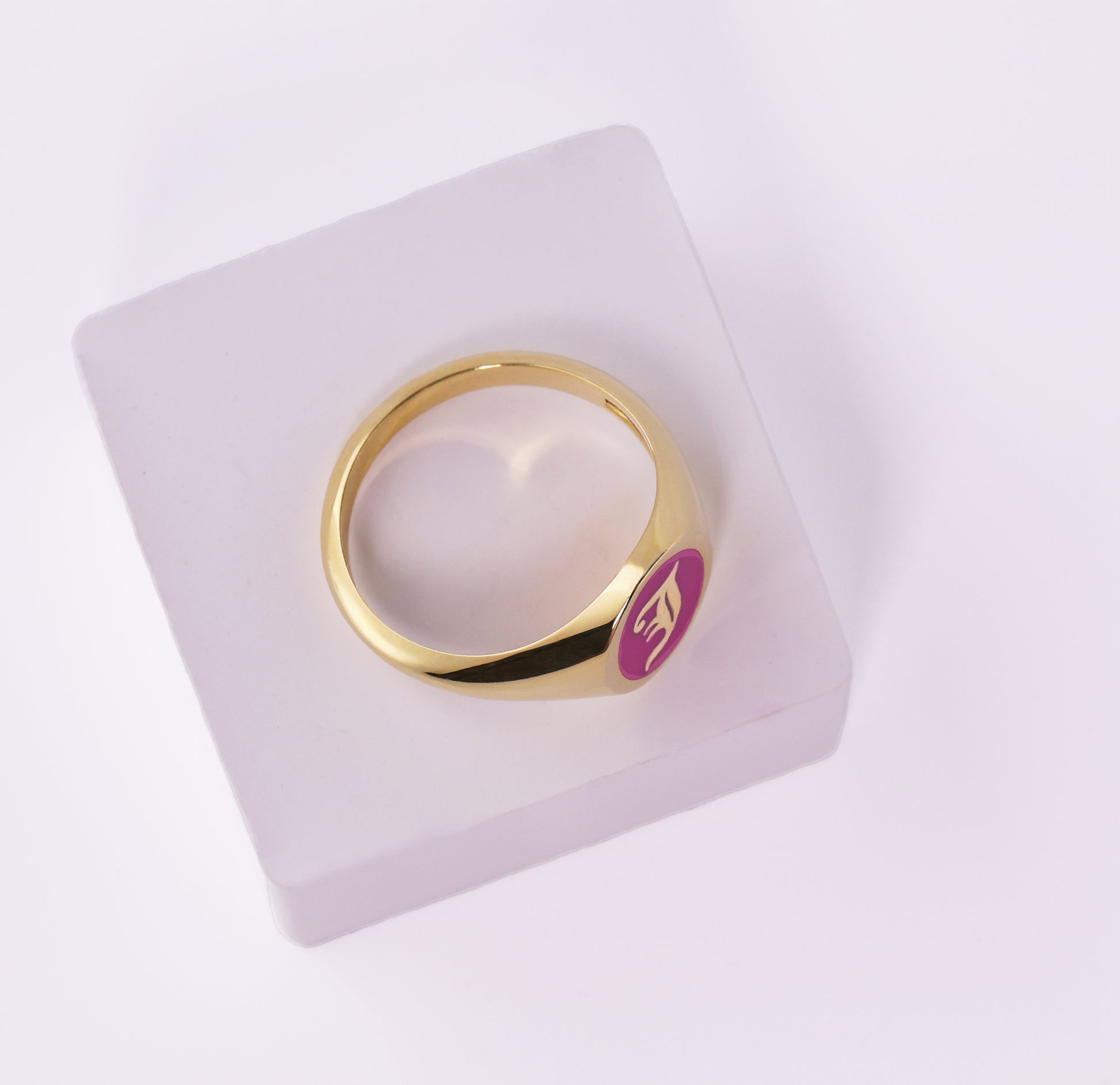 Gold signet ring with J initial and pink enamel