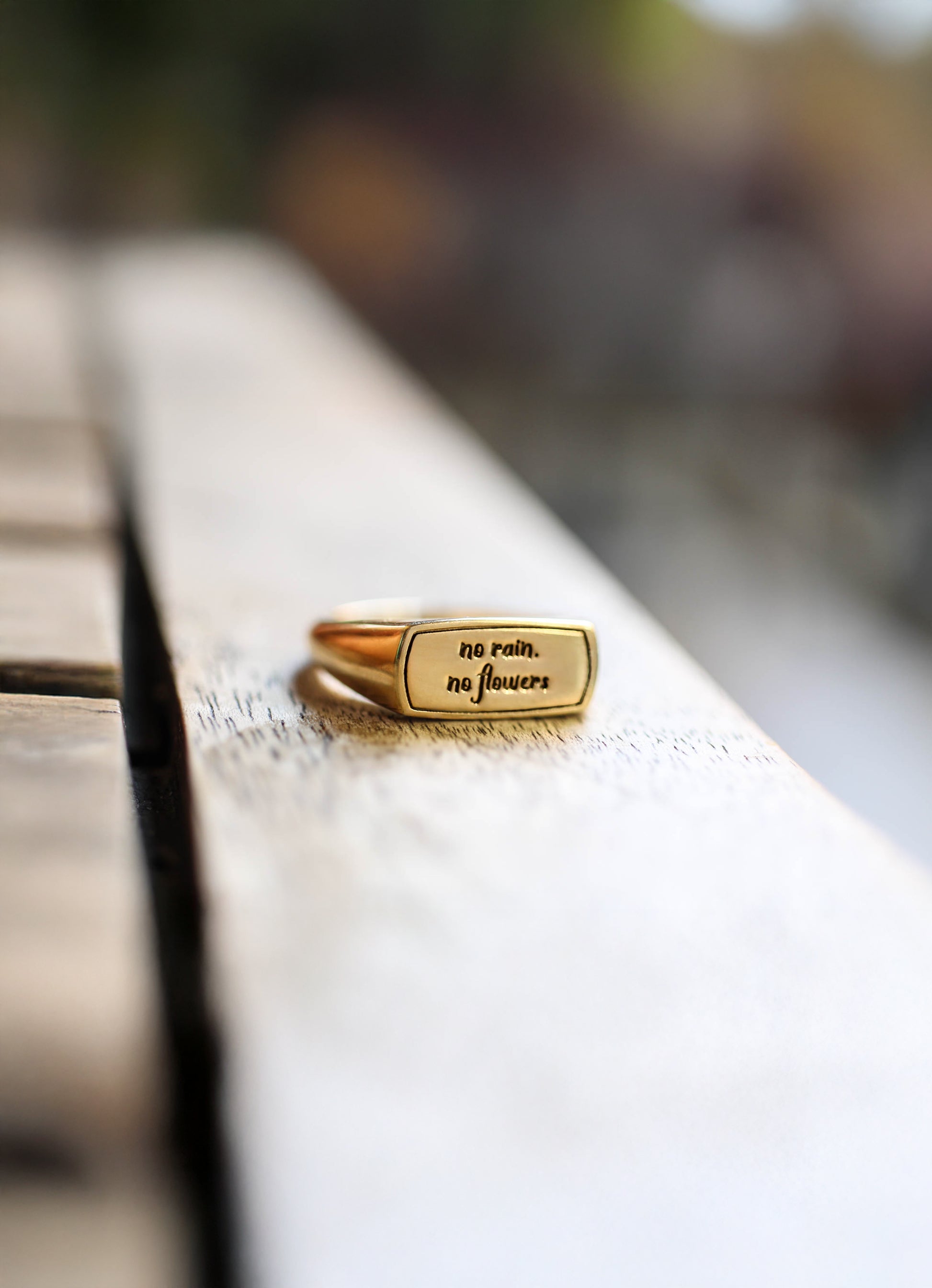 Close up of a solid gold inspirational jewelry ring.