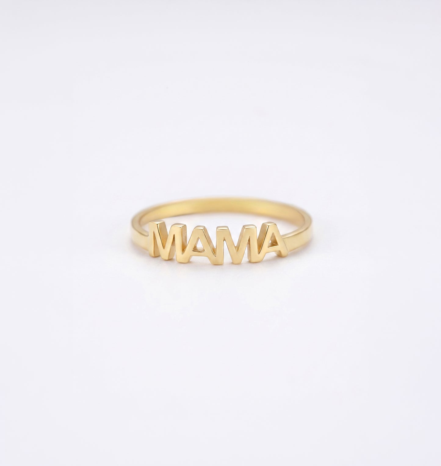 Gold MAMA' ring on a white background