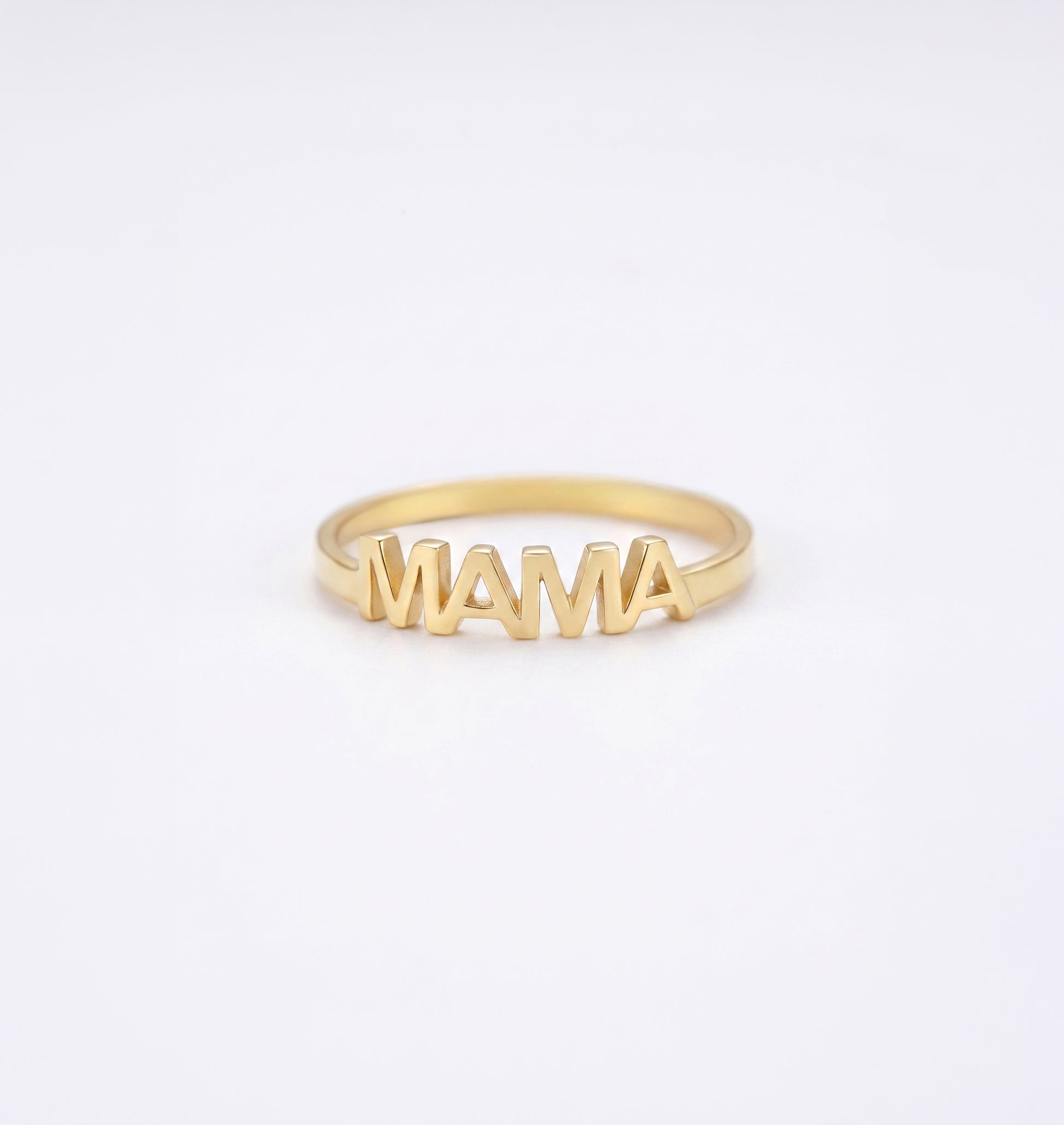 Gold MAMA' ring on a white background