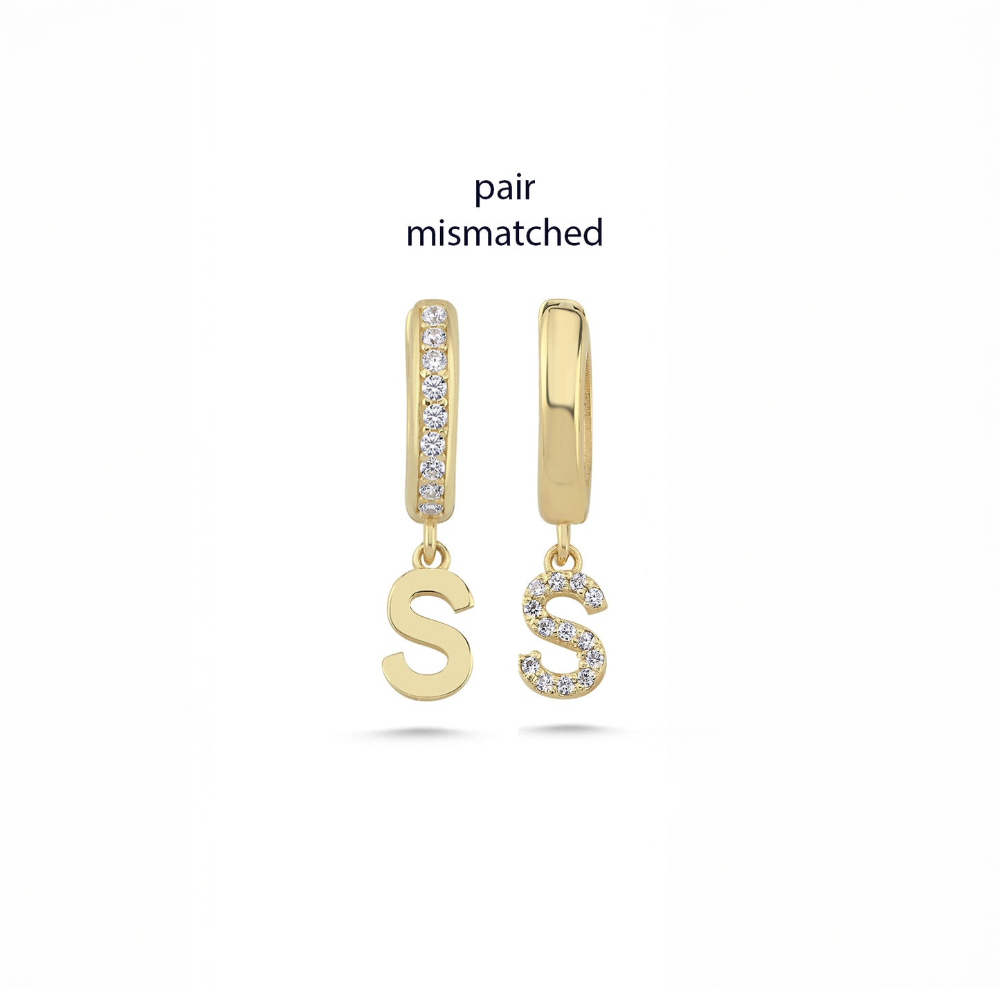 pair of dainty gold initial earrings