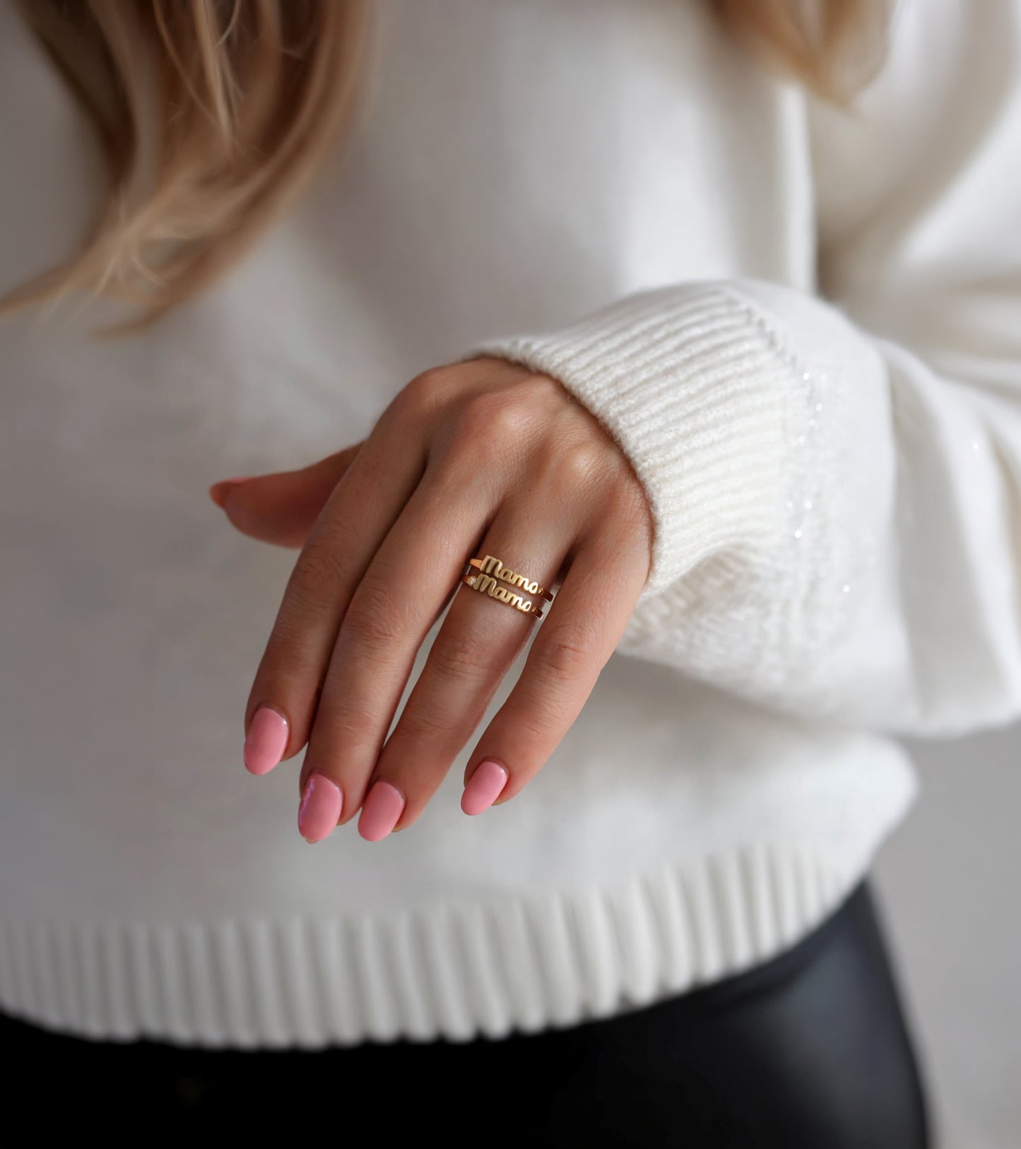 Close-up of a mom hand wearing a gold mama rings