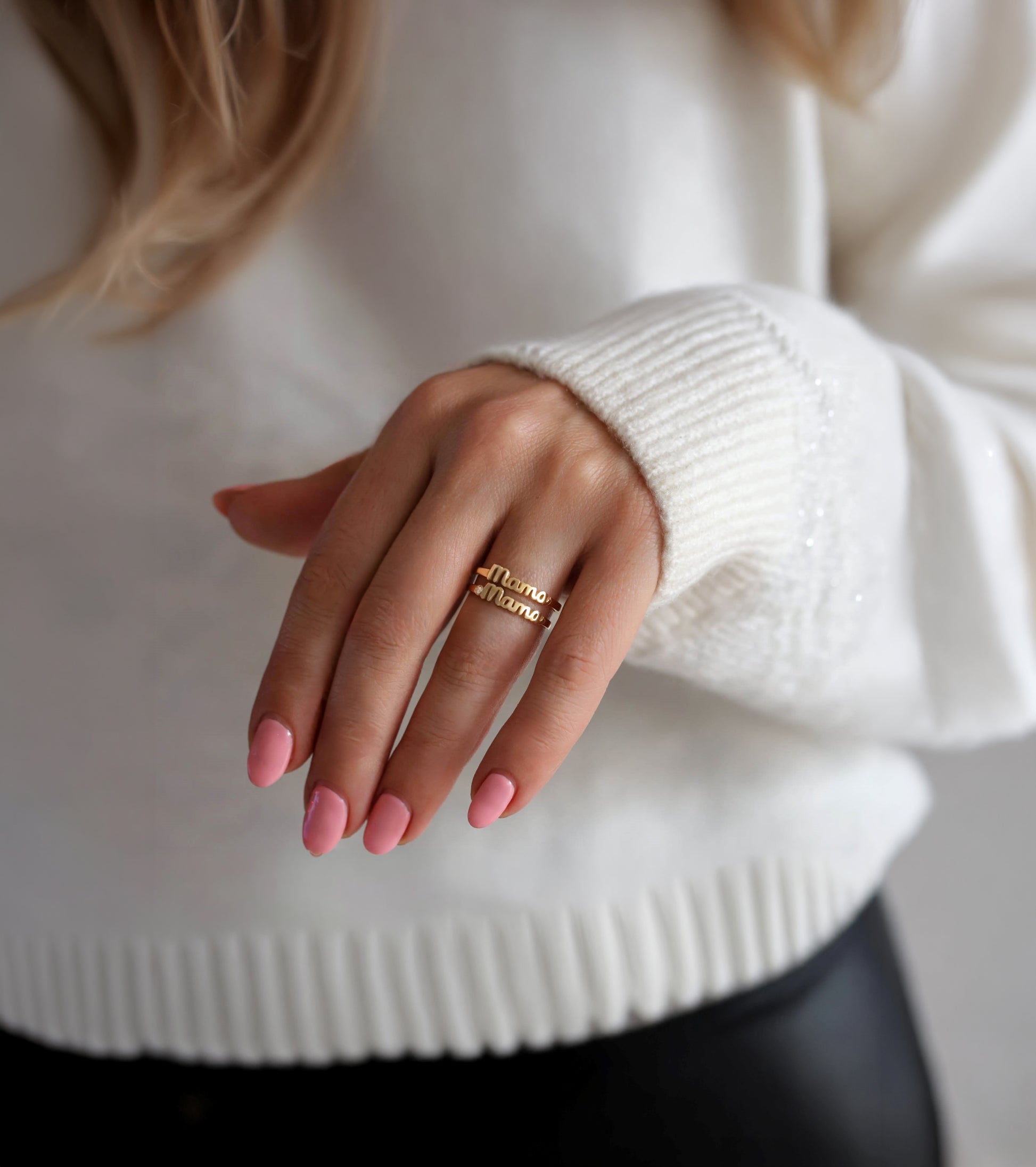 Close-up of a mom hand wearing a gold mama rings