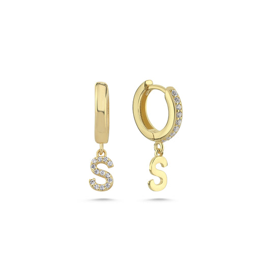 Gold initial earrings featuring 'S' charm on a white background