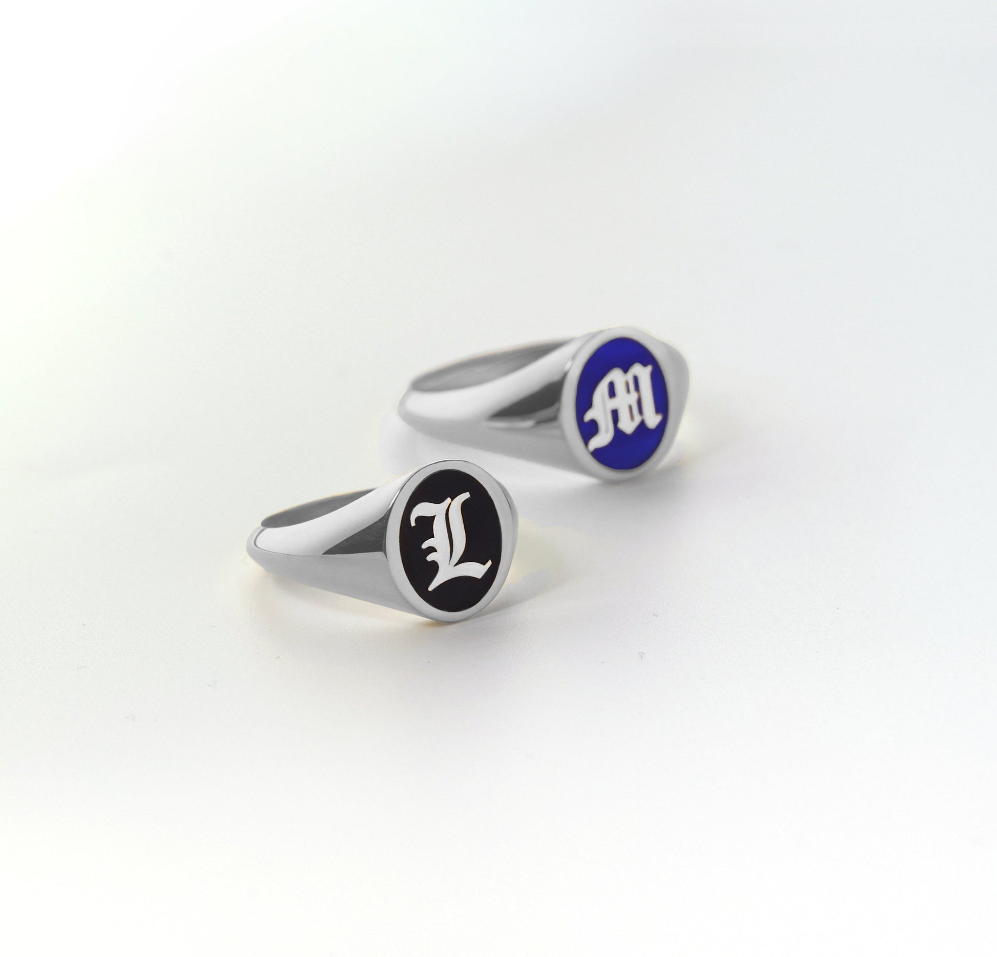 personalized silver initial rings with black and blue enamel.