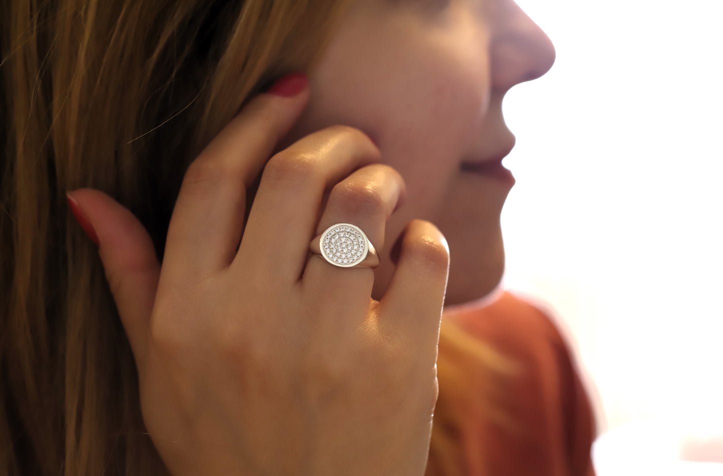 925 sterling silver signet ring with a fully diamond paved face.