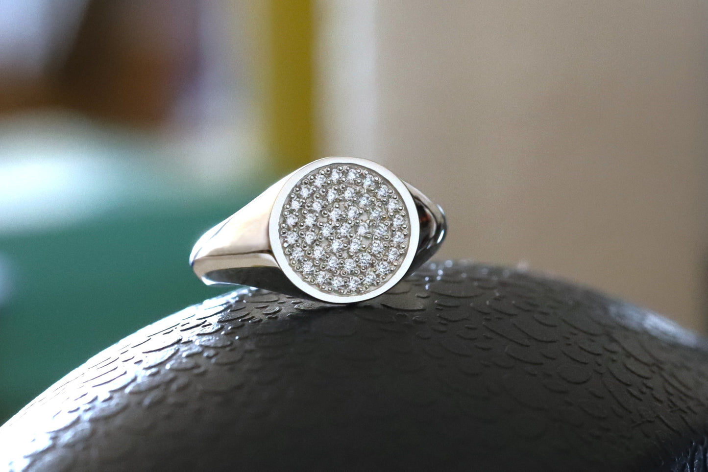 sterling silver signet ring with a fully diamond paved face.