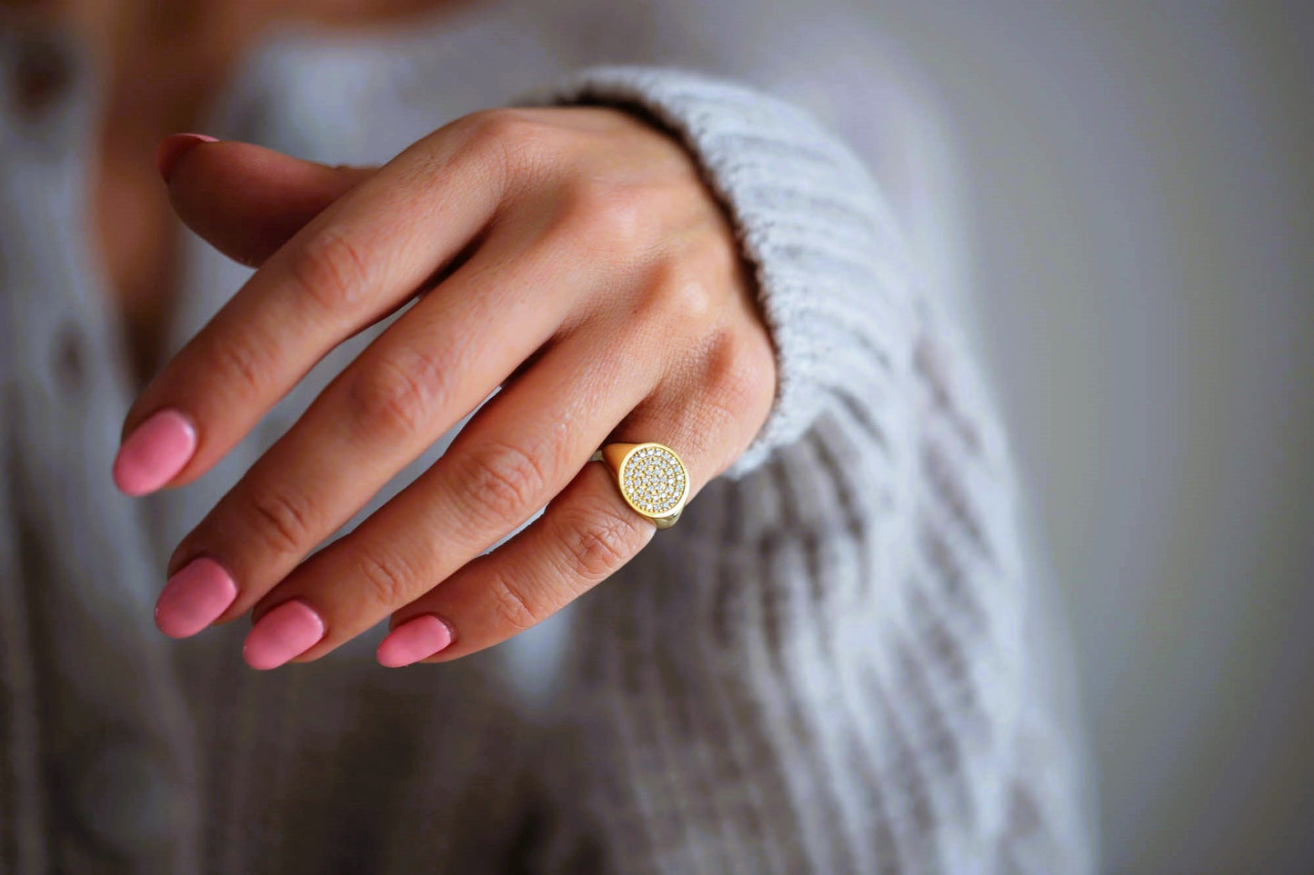 Womens diamond signet ring worn as a statement pinky ring