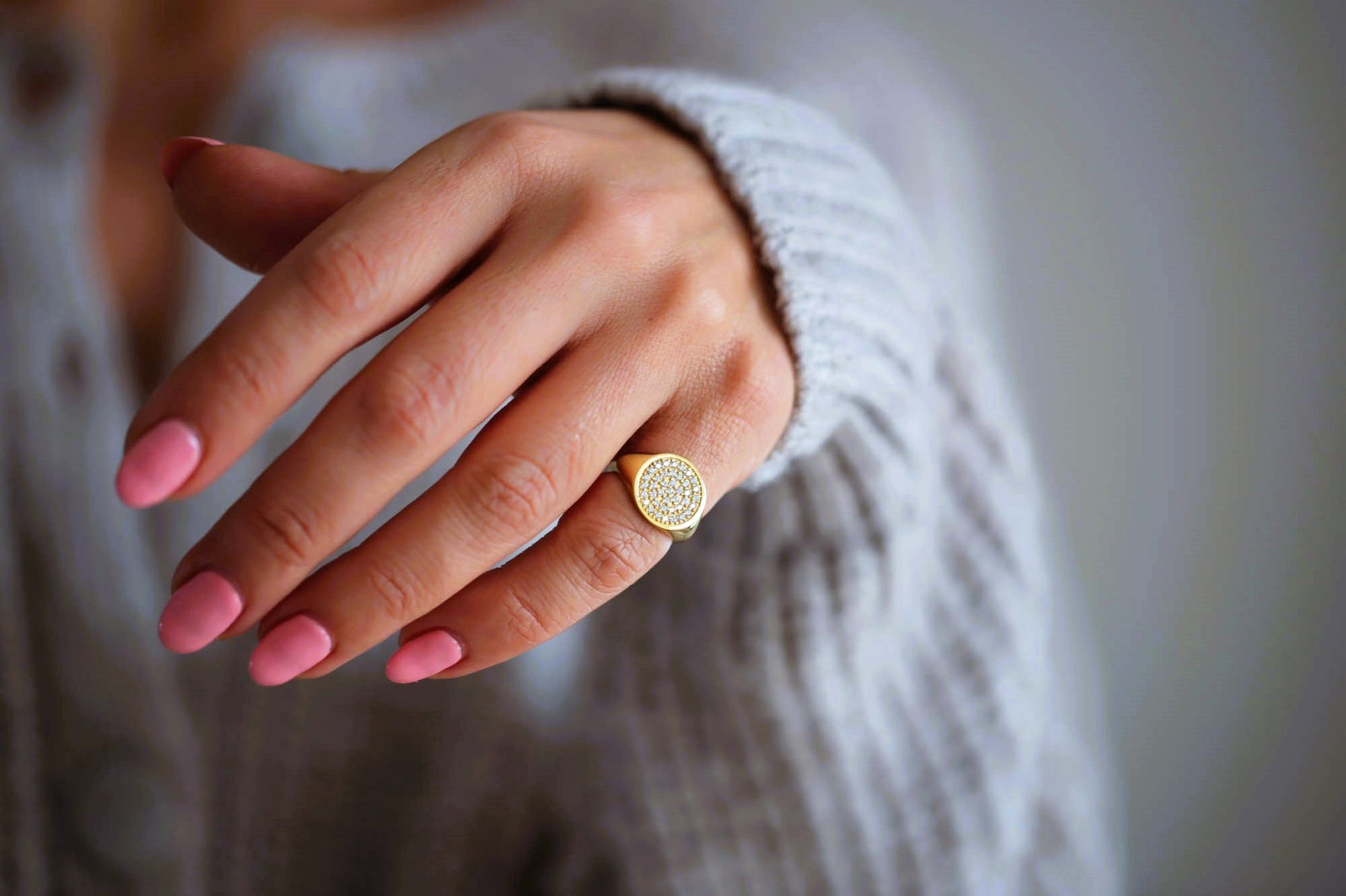 Womens diamond signet ring worn as a statement pinky ring